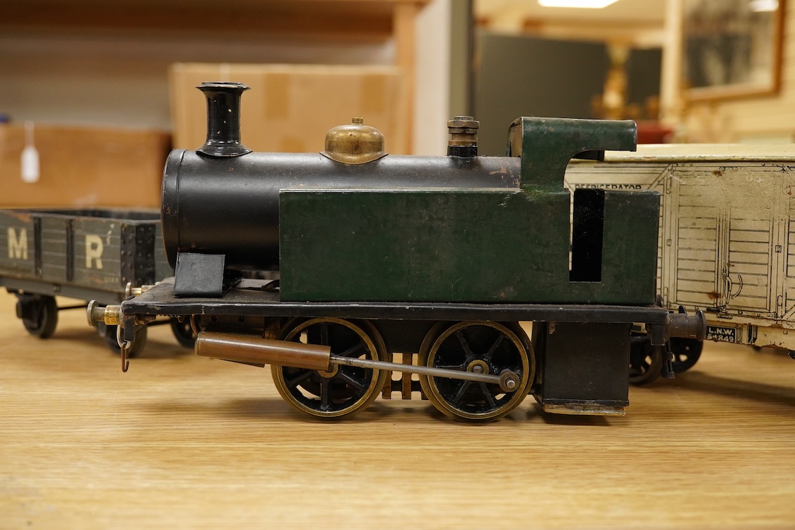 A Gauge One live steam 0-4-0T locomotive in the style of a Bowman model locomotive, with spirit fired with two simple outside oscillating cylinders, together with five LNWR and Midland Railway freight wagons, including a